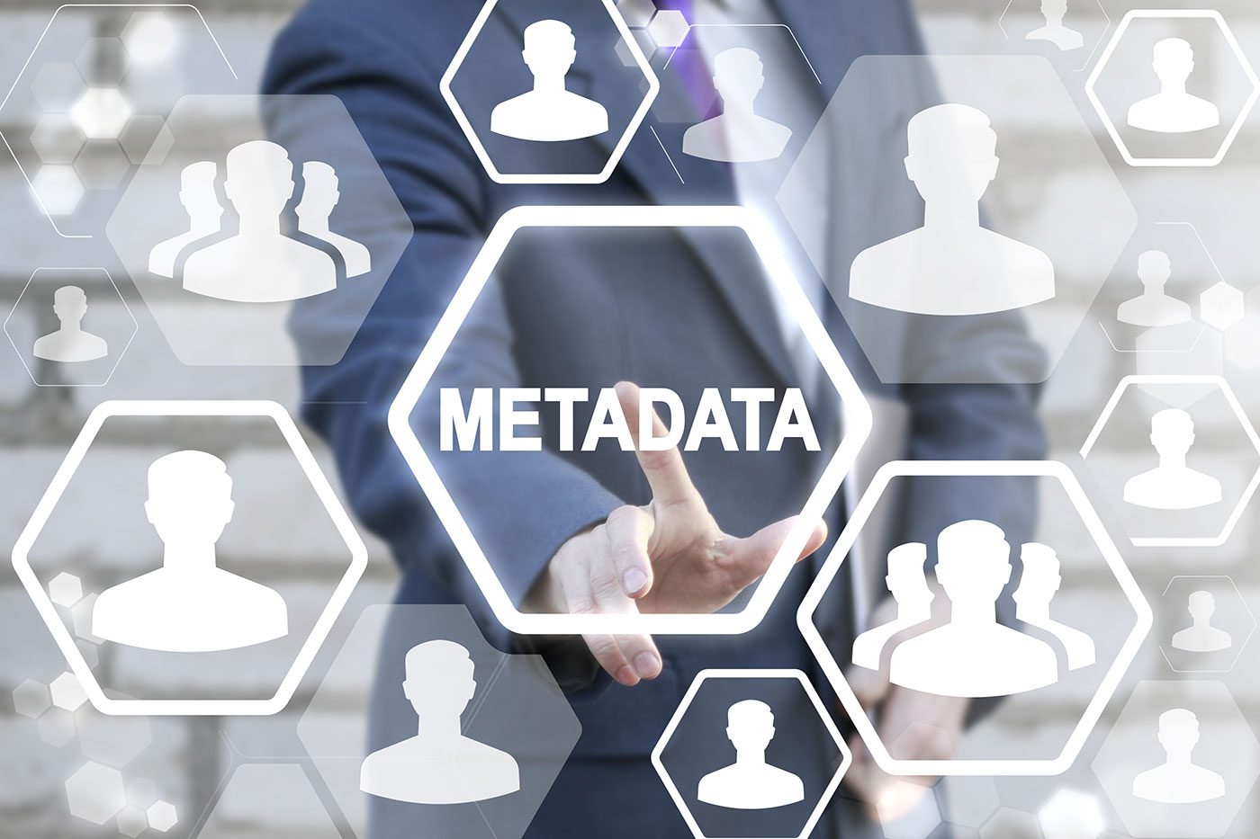 business man touching the word metadata