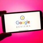 Google Reviews logo displayed on a smartphone screen