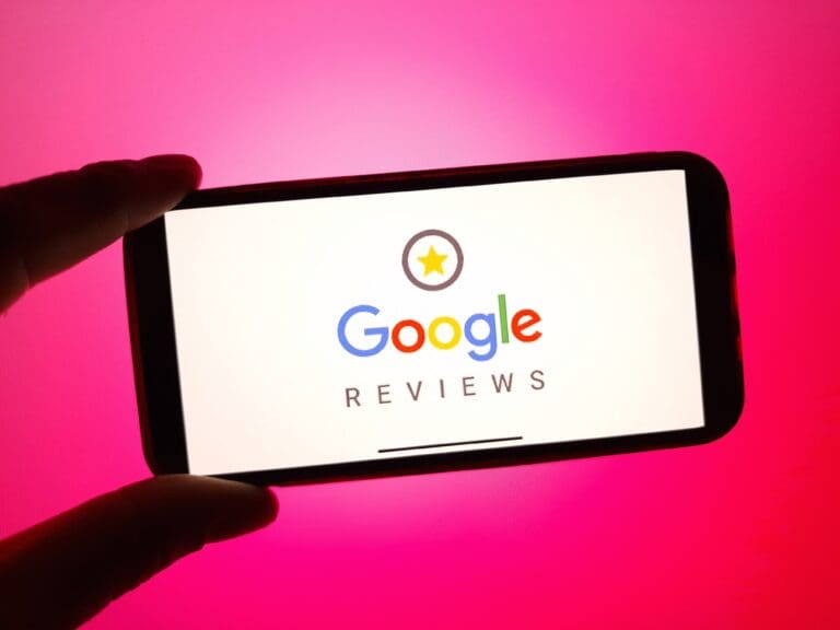 Google Reviews logo displayed on a smartphone screen